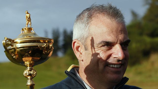 Europe captain Paul McGinley holds the trophy ahead of the 2014 Ryder Cup (Reuters)